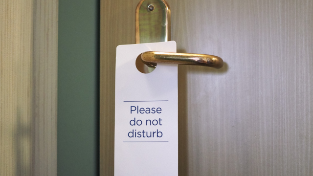 Please do not disturb sign on a door knob