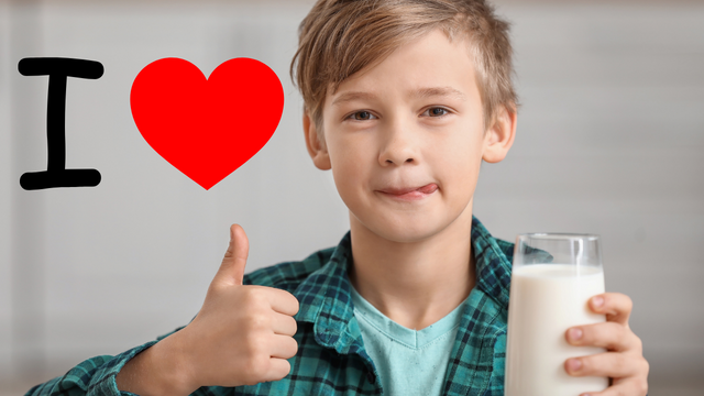 A kid drinking milk