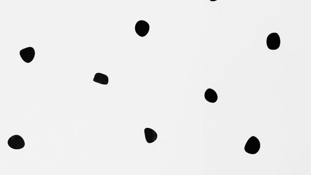 black dots on white paper